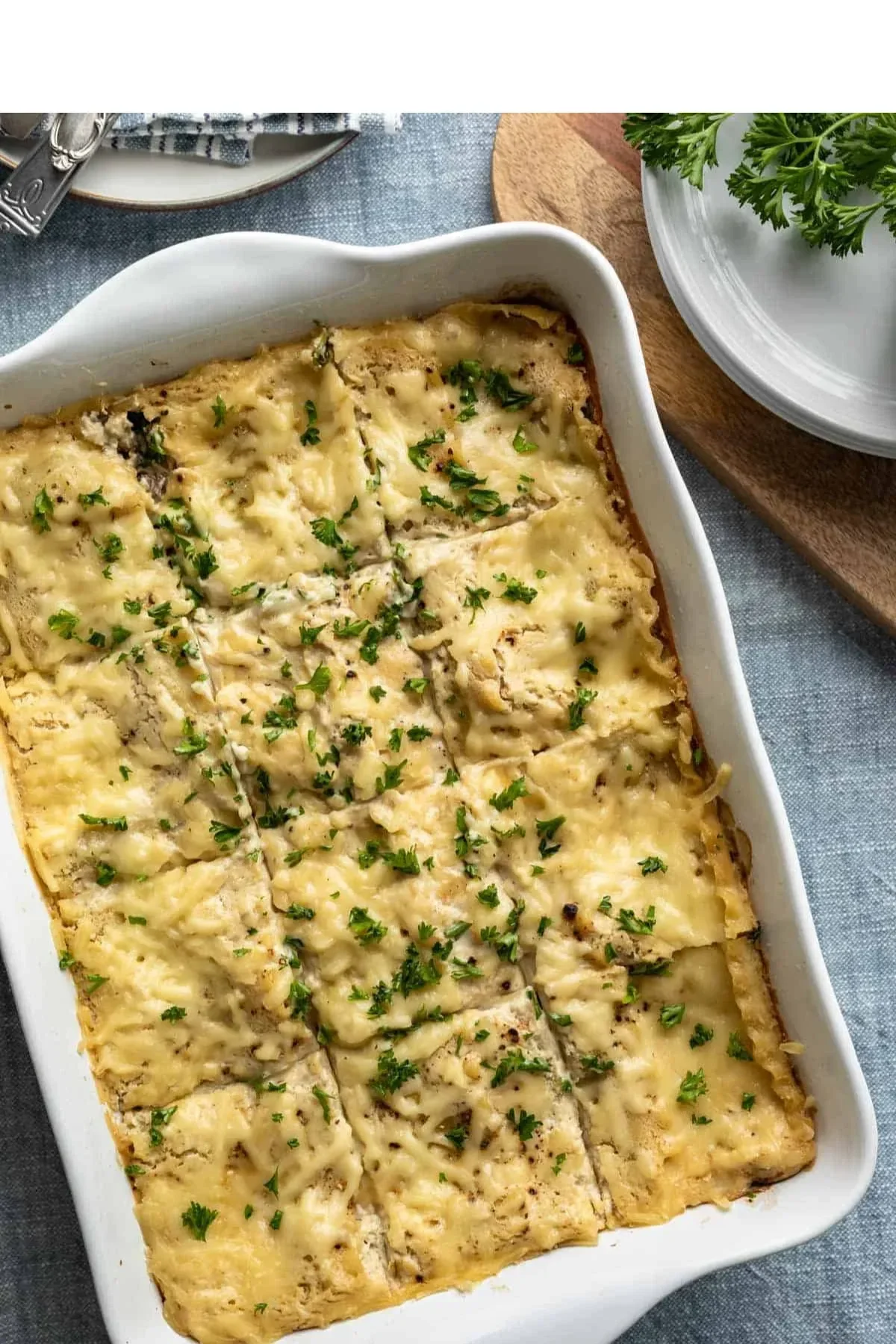 Slice of vegan white lasagna with layers of creamy plant-based ingredients