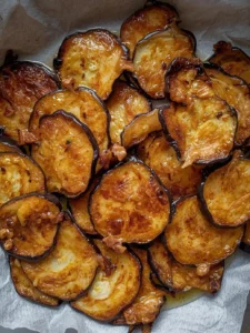 Fry the eggplant slices in sunflower oil until golden on both sides. Drain on kitchen paper.
