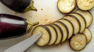 Slice the eggplants into 1/2 inch thick rounds.